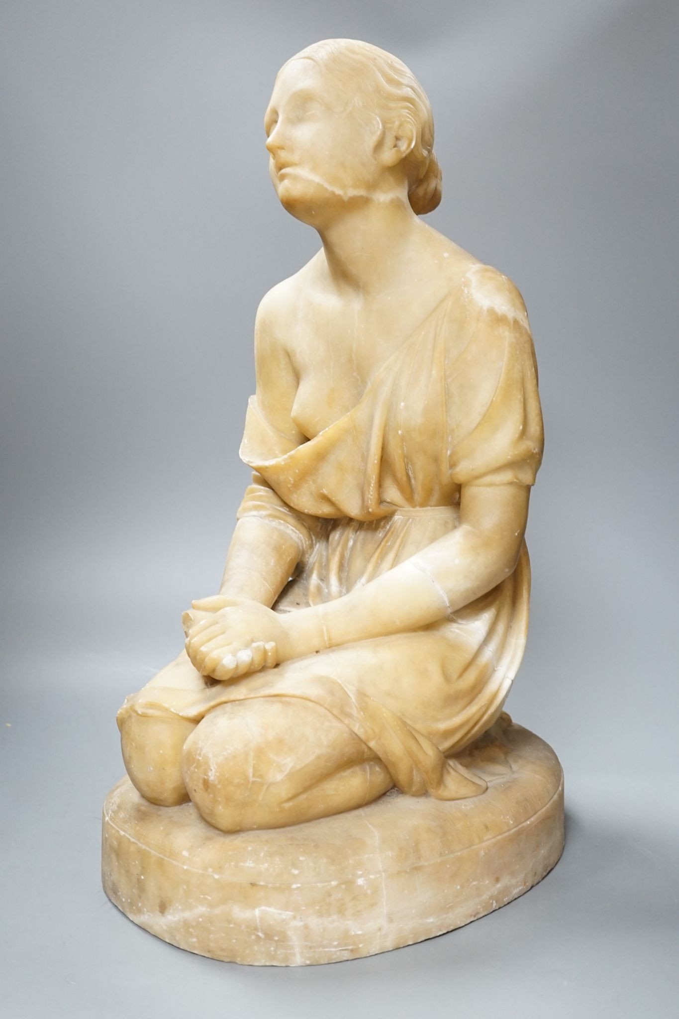 A Victorian alabaster figure kneeling female, 51cm